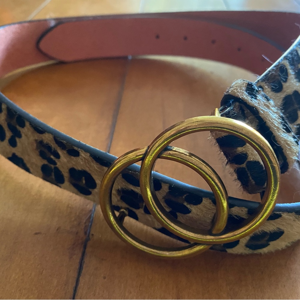 Cheetah belt with gold buckle. Faux acrylic hair.
